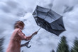 a woman with red hair tries to hold her umbrella in a storm