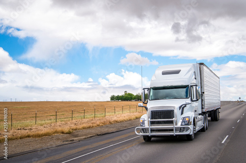 White Big Rig Semi Truck Transporting Food In Refrigerated