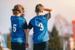 © matimix - Young Footballers Standing in Wall Soccer Wall During Free Kick. Soccer Tournament Game for Youth School Teams. Boys in Blue Jersey Soccer Kits