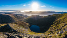 Morning View From Sharp Edge On Blencathra, Lake District, Cumbria With Lake Tarn And Cloud Inversion Over Mountains In The Distance
