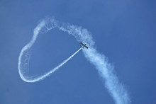 Airplane Looping The Loop With A Vapour Trail