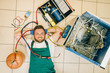 © Nomad_Soul - Repairman lies near refrigerator at home, top view