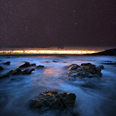 Wall Mural - night sky from a rocky beach. cornwall, uk.