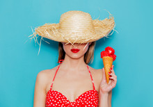 Young Woman In Red Bikini And Straw Hat With Ice Cream