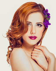 Poster - Redhead girl with flower, isolated.