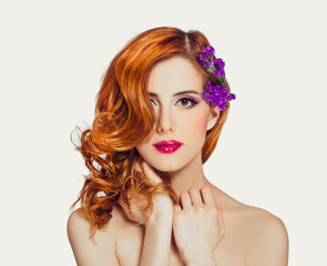 Poster - Redhead girl with flower, isolated.