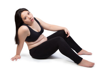Wall Mural - lazy fat woman bored face tired exhausted to exercise weight loss sitting on ground isolated on white background