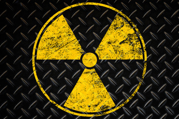 Poster - Yellow radioactive sign over black background