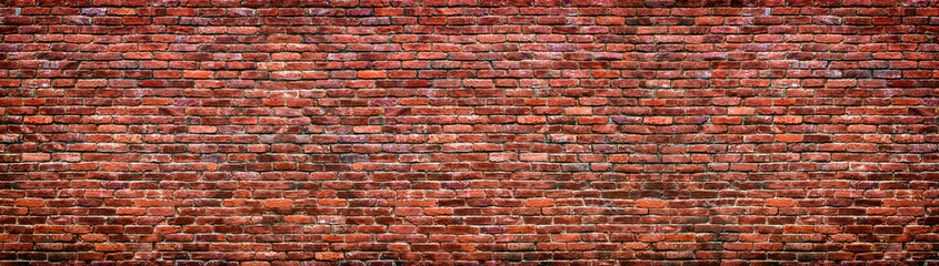 Wall Mural - Old brick wall background. Panoramic texture of red stone.