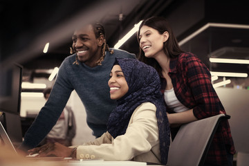 multiethnics team of software developers working together