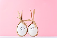 Funny Homemade Eggs With Faces On A Pink Background. Easter Or Happy Couple Concept