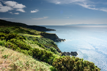 Wall Mural - seascape with cliff  in terceria, view of the coastline in terceira with cliff in the background. seascape in azores, portugal.