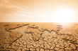 © scharfsinn86 - World map in the desert. Global warming and climate change concept