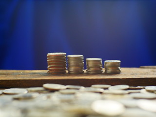 stack coins on blue background,concept save money