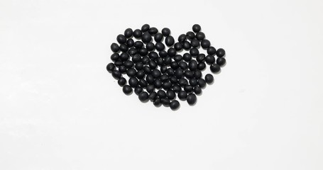 Canvas Print - Stop motion of black bean form a heart shape