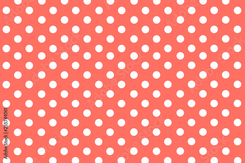 classic living coral background with symmetrical white polka dots