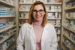 © Jacob Lund - Confident female pharmacist on drug store