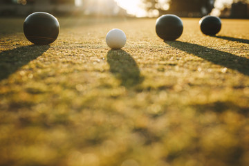 Close up shot of boules lying on ground