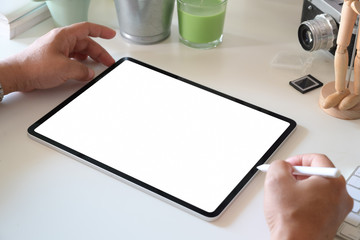 Man sitting and woking with tablet in office workplace