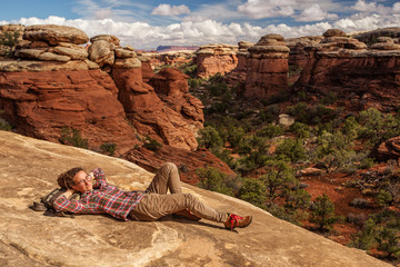 Poster - Hiker in Canyonlands National park, needles in the sky, in Utah, USA