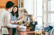© whyframeshot - Attractive Asian couple marry family  preparing cooking food dinner together with happiness and freshful in home kitchen family ideas concept