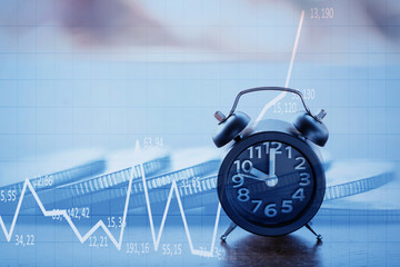 Double exposure Rows of coins of Clock,cash,money, dollar on the table,finance and business concept,Tex time soft focus and blurred style,dark tone.