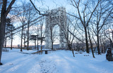 Abstract industrial bridge in winter season. Steel George Washington Bridge   over Hudson River. Snow covered ground and bridge. Isolated architectural bridge.