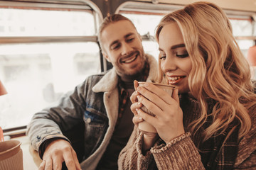 Smiling hipster man looking to beloved woman