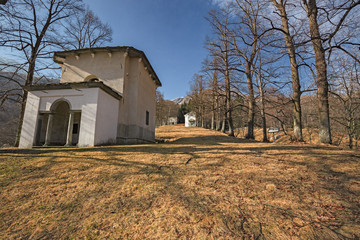 Panoramic view in the afternoon light on a winter day, of the seventeenth-century chapels of the monumental complex dedicated to the Virgin Mary, of the Sanctuary of Oropa in Piedmont, Italy.