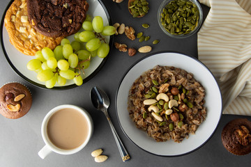 Wall Mural - Healthy breakfast bowl. Oatmeal with nuts - walnuts, chia seeds, pumpkin seeds, honey and fresh fruits, isolated.