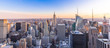 Panoramic photo of New York City Skyline in Manhattan downtown with Empire State Building and skyscrapers at sunset USA