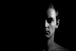 © Serhii  Holdin - Dramatic portrait of a guy on a black background, black and white photography