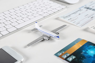 Composition with airplane model on table. Travel agency concept