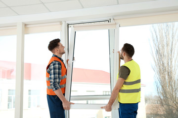 Sticker - Construction workers installing plastic window in house