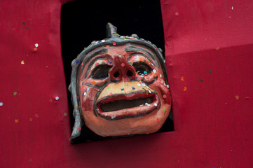 closeup of two mask posing on truck  who parading in the street