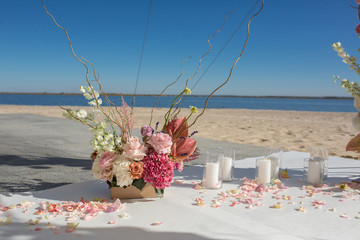 Wall Mural - Event decoration. Wedding chuppa at riverside decorated with fresh flowers. Florist workflow