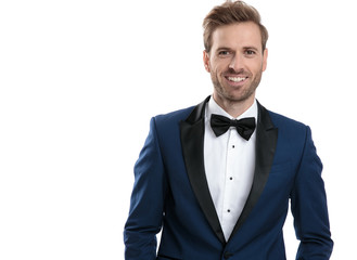 Sticker - elegant man in blue suit wearing a black bowtie smiling