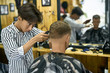 © Andriy Bezuglov - Man is cutting his hair in asian barbershop