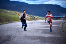 Two Young Men Fun Chase Run