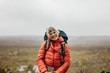 © Jacob Lund - Portrait of a smiling female hiker