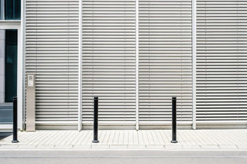 Sticker - empty sidewalk with modern building background with closed venetian blinds