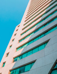 Wall Mural - Close up of a corporate building on blue sky