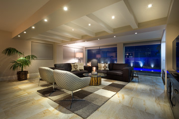 Modern living room with two black couches facing the window and another black couch facing the tow white couches in the living room