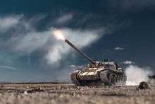Military Or Army Battle Tank Firing In The Desert War Ground. Fire Bursting From The Gun Barrel