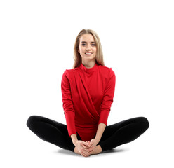 Poster - Young female dancer stretching against white background