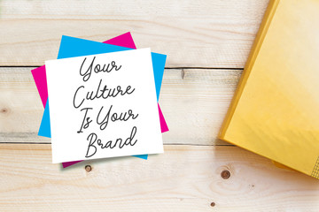 text sign showing Your Culture Is Your Brand on white sticky note