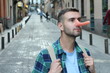 Man with a very long nose outdoors 