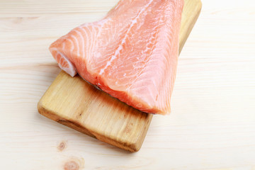 Poster - Raw salmon filet on wooden background