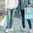 © golubovy - Shopping time. Casual leisure of urban family. Man and woman with paper bags. Couple in denim.