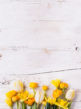 Yellow Flowers On A White Wooden Background. Copy Space.